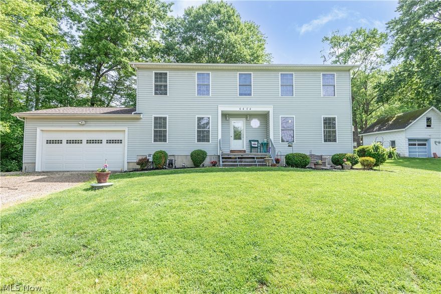 Welcome home to 6454 Luce Street, Franklin Twp, Kent, OH. You have earned the tranquility of this 2082 sf Colonial home on a dead-end street. This 2-story first floor boasts an open concept with living room, eat-in oak kitchen which includes large island with cook top range and seating, other appliances, and dinette area overlooking the backyard. Large bedroom with double closets and built-in office space, full bath, and laundry/mud room with access to the 2-car attached garage round off this floor. Second floor features 15x23 master bedroom, two additional nice-sized bedrooms and full bath. The lower level is setup as a rec room with finished ceiling awaiting your flooring & finished walls, if so desired. Utilities are in the full basement which you can heat with gas and/or wood burning furnace, full bath, loads of storage and walk out to the garage. Enjoy the serene setting while you entertain on your backyard patio. This amazing home comes with an additional bonus lot down the stree