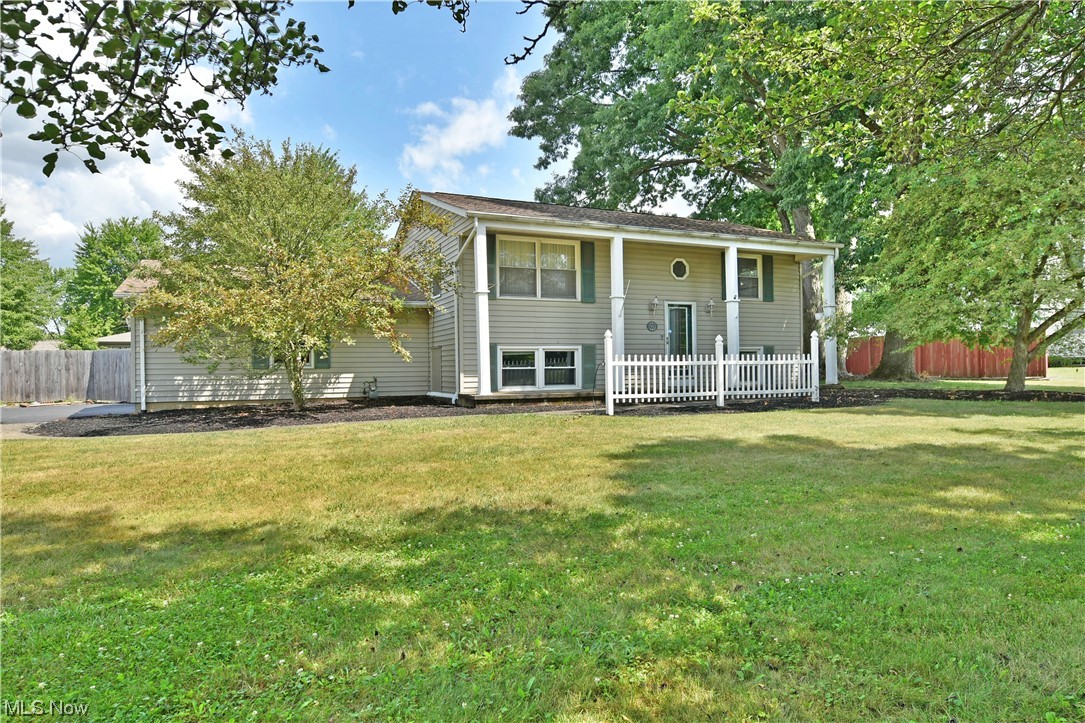Don’t sleep on this expansive Mineral Ridge bi-level offering up huge potential with its two floors of finished living space and a large, fenced-in backyard complete with a relaxing pool! The prominent corner property boasts plenty of curb appeal with its tall pillars that line the front of the white picket lined entry way. An attached two car garage makes for a quiet, side street entry while an easily finished sunroom overlooks the substantial brick patio. A decorative, glass front door overlooks the stained wood staircase that is trimmed in wrought iron handrails. Downstairs, the tastefully updated floorplan includes a tile lined kitchen that joins both a robust dining room, half bath and spacious family area with fireplace. Laundry services and utilities complete the floor along with a large bonus room for easy home office space. Upstairs, the hardwood filled living room branches away into a quartet of bedrooms as they accompany a fifth potential, currently configured as a walk-in c