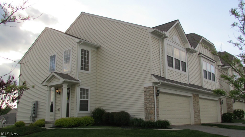 This spectacular home is 4 years young! Many upgrades to this trendy end unit town home! Brand new carpet 2014, 9ft ceilings, glamour kitchen with granite countertops, stainless appliances, hardwood floors, dining area overlooking pond. Lovely spacious 2 story foyer, very large master bedroom suite with walk in closet, 2nd floor laundry, and spacious loft. Neutral decor, neat and clean, ready to move in. You will be impressed with the little things in this home such as upgraded fixtures, lighting, hardware and doorknobs, etc. You will find the location convenient to shopping and restaurants, parks, as well as friendly neighborhood.