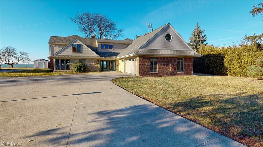 1.7 acres on the water and 4945 square feet of lakefront views from almost every room. No expense was sparred in this custom build on Lake Erie with lake access. over 700,000 of new construction completed 2002, Up-Level Solid Construction, over 30 tons of structural steel used, all exterior walls sheathed in 3/4 plywood, added sound insulation on interior walls, Extensive supplementary climate control systems, four zoned forced air systems, 5 zones tile heating, 2 zone ceiling radiant heat system in north facing rooms, snow melter coils in driveway near garage, new sewer line and storm drains added, all tile is low skid high traction tile, all doorways are wheel chair width, plumbed behind wall for downstairs utility room(currently upstairs),entire house wired for catV, east end of breakwall was enlarged at base and filed with concrete 2001, reventment of large block placed adjacent to wall in 2000 to prevent scouring, gravity seawall retains its original construction of filler-high we