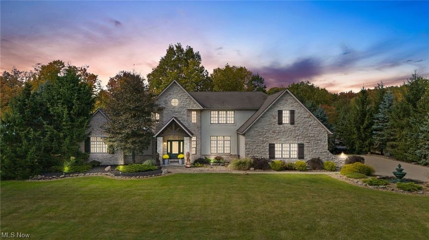 Nestled on a sprawling 5.5-acre canvas, this exquisite, 4 bedroom, 4 bath custom-built executive home located in the award winning Highland Local School District, is a testament to superior craftsmanship. A truly unique gem, this residence stands apart from cookie-cutter homes, showcasing numerous exceptional features, leaving you in awe from the moment you arrive at the long, winding driveway leading you to the property which is free of HOA rules. 

Inside, the over 6000 sq ft of living space delivers a lifestyle of convenient luxury where the open foyer with vaulted ceilings seamlessly connects to the living spaces, including the great room with a 2-story gas fireplace and towering windows. The nearby chef's kitchen is adorned with granite counters, under-cabinet lighting, and stainless appliances, connecting to the large dining room with a tray ceiling that awaits your culinary creations and celebrations. Further entertainment space can be found in the finished basement with a large rec room with a gym, wet bar.

Outside, a huge stamped concrete patio with a magical waterfall beckons you to explore as you make your way to the pergola and 8-person hot tub for unforgettable gatherings. 

Additional amenities include a full security system, geothermal heating, high-efficiency Anderson windows, a 4-car garage, central vacuum, a gorgeous first floor primary suite and so much more. Your dream lifestyle begins in this Hinckley masterpiece!