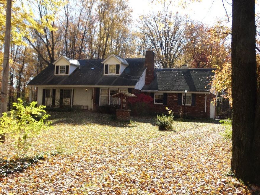 Lovely Brick Cape Cod with 4 bedroom, 2 bathroom home with attached 2 car garage. pond, 25X40 barn with 4 stalls.  Huge trees and trails, small stream.  Gazebo and playhouse need repairs ("sold in as is condition")