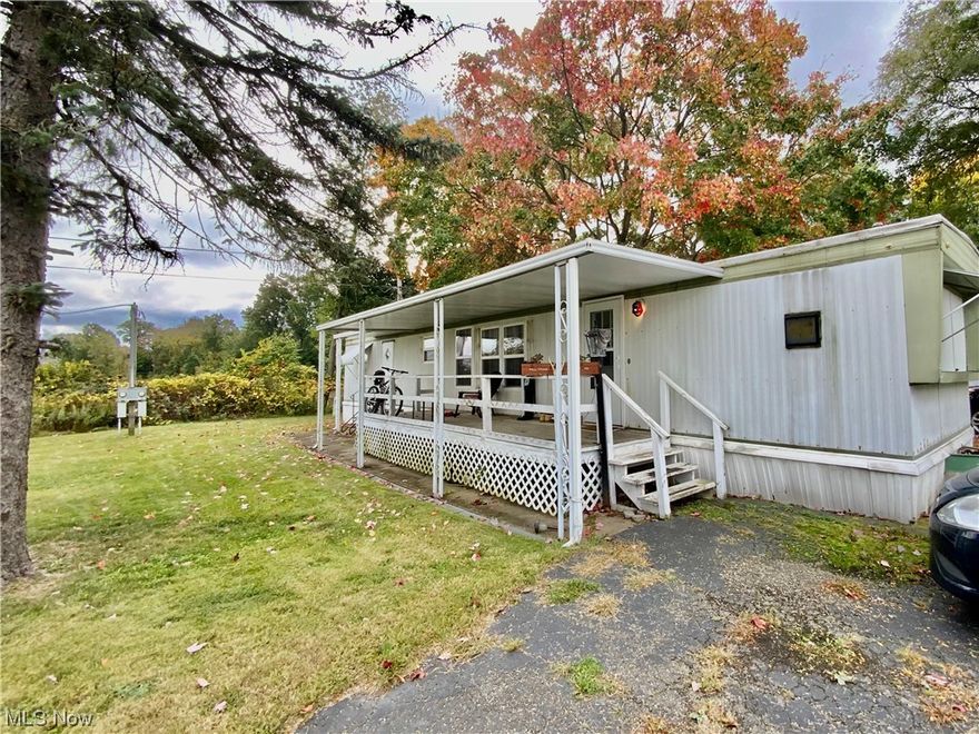 Akron! Avon Park! Turn-Key Mobile home!! Looking for affordable living & ready to move in? Live for less!! Centrally located this home provides immediate access to expressways and all the amenities including shopping, healthcare facilities, and park area, which is within walking distance!! This is a cozy 2 BR home, with approximately 720 sq ft! It has a covered wooded deck and double entry doors! Open & inviting eat- in kitchen with cupboard space & dining area! Comfortable living room to entertain in! Spacious bathroom with walk in shower & laundry hook ups! Additional paved parking space!  larger lot area to enjoy outside! Don't miss out on this one!! Updates 2022) A/C unit, Hot water heater, furnace, Pella windows, new carpet, flooring, light fixtures, counter tops, drapery and paint! Seller is leaving it mostly furnished! It comes with 5-piece electric/leather living room set, Solid Cherry 5-piece bedroom set, which includes a new mattress that was never used, L-shaped desk and chair; Furthermore, a fully stocked kitchen with pots, pans, plates, glassware ext... Call today for more information & all you have to do is move in!! Pets are welcome! They need to be approved and application to park is also required for park residence! lot fee is 446 a month!