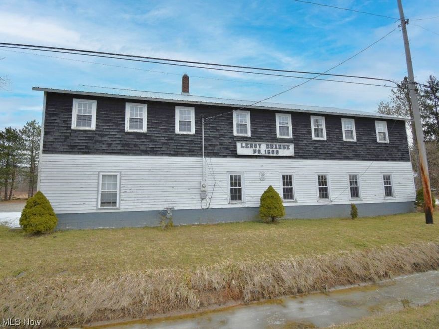 Welcome to the historic Leroy Township Grange Building, now transformed into a captivating residential home, awaiting its new owners to write the next chapter in its storied history. This unique property and layout has endless possibilities. The main floor offers a spacious kitchen, two bathrooms and plenty of storage space. The addition of a room off the kitchen in 2021 enhances the functionality of the home, offering versatility to suit your lifestyle needs. Walk upstairs and step into the beautifully updated second level (2020) where a spacious family room welcomes you with its inviting atmosphere. Entertain guests at the custom bar, showcasing exquisite craftsmanship, while the custom counter adds both style and functionality to the space. Refinished hardwood flooring adds warmth and character. Additional improvements in the family room include new ceiling fans and electrical outlets. Recent upgrades outside include a driveway expansion and grade and gravel work completed in 2021, providing ample space for parking. Experience comfort and peace of mind with a brand new septic system installed in November 2023, offering reliability and efficiency for years to come. Seize the chance to own a piece of history and make this remarkable property your own.