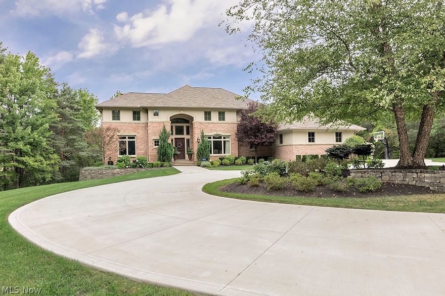 An Extraordinary Masterpiece of Design and Craftsmanship.
Step into a rare opportunity to own a custom-designed estate of unmatched elegance, built in 2000 and set on five meticulously manicured acres. This architectural gem offers over 9,400 square feet of exquisite living space, designed to impress at every turn.

A grand two-story great room welcomes you, with soaring ceilings and walls of windows framing breathtaking, uninterrupted views. At the heart of the home, a fully remodeled chef’s kitchen boasts top-of-the-line appliances, bespoke cabinetry, a sunlit breakfast room, and a charming octagonal sitting area—perfect for intimate gatherings or morning coffee.

The first-floor primary suite is a true retreat, featuring dual boutique-style walk-in closets and a spa-inspired bath with custom tile, Italian marble, and heated floors. Every level offers convenience, including full laundry rooms throughout.

Upstairs, three spacious bedrooms and two elegant full baths provide comfort and style. The fully finished walkout lower level is an entertainer’s dream, with a second kitchen, guest suite, full bath, private gym, family/rec area, and a state-of-the-art golf simulator—opening seamlessly to a spectacular outdoor sanctuary.

Outside, the estate dazzles with a full-length rear deck, expansive covered patio, sparkling inground pool, and a luxurious 5 person hot tub—all surrounded by professionally landscaped gardens and equipped with integrated surround sound.

From soaring ceilings and timeless millwork to curated lighting and designer finishes, no detail is overlooked. This home effortlessly blends grandeur with warmth, sophistication with livability—a true testament to refined luxury living.