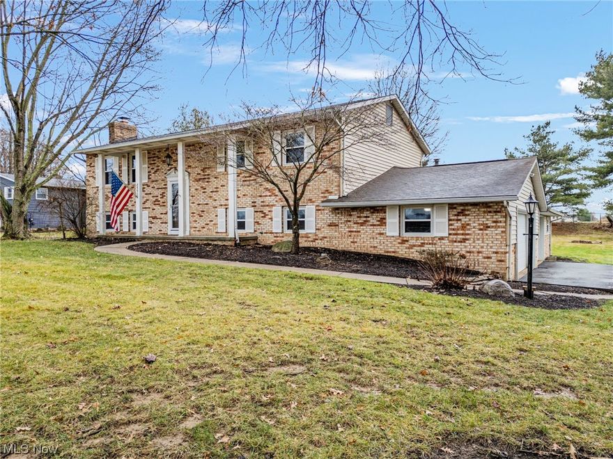 Nestled on nearly an acre of 8550 Portage St NW in Jackson Township, this unique home exudes charm & quality craftsmanship.  As the former residence of the builder & now with only its second owner, if offers one-of-a-kind living experience.  Inside a welcoming rec room w built ins & bookshelves provides a cozy retreat.  New carpet graces 3 of the bedrooms while the 4th bedroom boasts of hardwood floors.  The living room, bathed in natural light from a vast picture window is a focal point.  The owner's suite boasts a vanity area, & there is an incredible 4-season room adding versatility.  Outdoor living is a delight w a spacious 16 x 20 deck w treated wood & a patio.  2 new sliding glass doors were installed in 2023.  The oversized heated garage accommodates at least 5, maybe 6 vehicles & extras, white a 12 x 20 storage barn adds practicality.  Custom built w attn to detail, this home seamlessly blends indoor & outdoor spaces.  Its history as the builder's home, coupled w its unique feature, makes is a must see property.  Don't miss the opportunity to own a residence with character & all the bells & whistles.