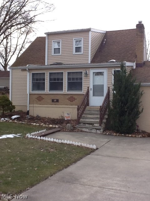 Move right into this totally updated and well maintained home. Everything in excellent condition. The roof, carpeting, furnace, wiring and glass block windows were installed in 2009. As you drive up you will notice a large two car garage and an enclosed 20x7 finished porch with two skylights. The kitchen has lots of cupboards and place for a table. The family room is cozy with a beautiful full wall fireplace. The sliding door in the family room goes out to a wood deck and fenced in back yard.