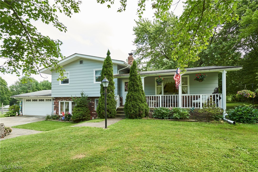 If you’ve been searching for space to spread out and a home that truly welcomes you in—this is it.
Located on 2.99 acres, this beautifully cared-for split-level offers the perfect blend of comfort, warmth, and room to gather.
Step onto the charming 23-foot front porch and be invited into the spacious living room and dining area updated with hard-surface flooring. The kitchen is open and functional, offering generous counter space, ample cabinetry, and newer appliances—perfect for meal prepping, casual breakfasts and holiday baking.
Downstairs, the oversized family room is designed for making memories. Large windows fill the space with sunshine, while a cozy gas heater adds warmth on brisk mornings. Whether you're hosting game day, setting up a game table, or simply relaxing with loved ones, there’s room for everyone. A full bath and sliding doors to the covered patio complete this level—ideal for indoor-outdoor entertaining.
Upstairs, you’ll find three comfortable bedrooms and a full bath with a walk-in shower. The owner’s suite includes double closets for plenty of storage.
Step outside to enjoy the peaceful, park-like backyard. Whether you're sipping morning coffee on the patio, watching the sunset, or hosting a summer BBQ, you’ll love this private slice of country paradise. Recent updates and Highlights: Furnace (2018), Flooring (2019 & 2021), Septic serviced (2024), Convenient access to highways, Move-in ready and waiting for you.
If you’re looking for a home where memories are made and life slows down just enough to enjoy it—schedule your private tour today!