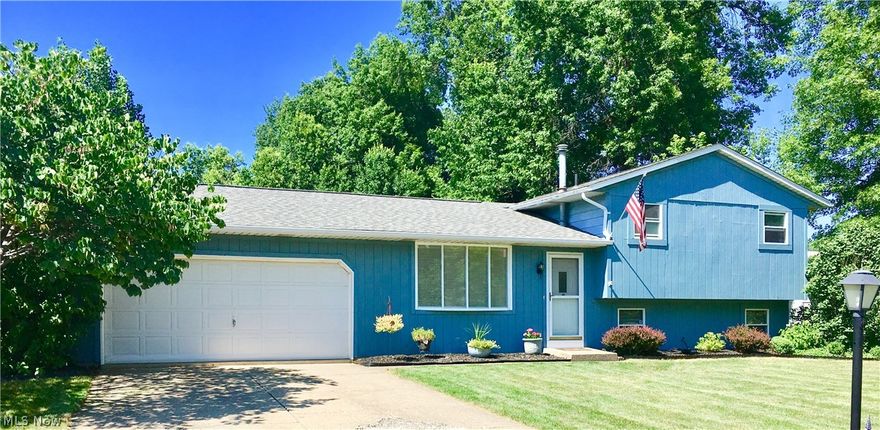 Private extra large lot! Almost 1/2 acre with additional land to expand. New roof 2012. Vermont Casting wood burning fireplace. Whole house fan. Large eat in kitchen with newer laminate flooring that continues into front entrance way. Pella patio door with built in blinds opens out to a well maintained wood deck. 2 1/2 car garage with pull down ladder and storage above. Custom wood blinds in living room & family room. Large utility room with extra storage off of it. Furnace and thermostat are air conditioning ready just need air conditioning unit. The hair stylists shampoo bowl and home security system does not convey.