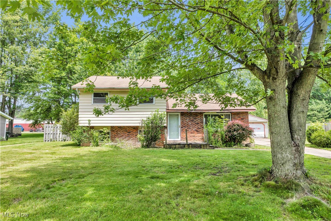 OPPORTUNITY KNOCKS in North Ridgeville! Unlock the potential in this 3-bedroom, 1.5-bath split-level diamond in the rough, perfectly positioned on nearly half an acre in a prime location near NR schools, shopping, dining, I-480, and the turnpike. With a versatile floorplan, this home is a fantastic canvas for investors or owner-occupants ready to roll up their sleeves and build equity. The main level features a spacious living room that flows into the kitchen and dining area—ideal for open-concept living. Upstairs, you'll find three generously sized bedrooms and a full bath. The lower level has been waterproofed w/ a transferable warranty and offers even more value with an additional living space or potential 4th bedroom, a laundry/utility room, and a room already plumbed for a half bath. The property also features a newer hot water tank, a sprawling large backyard, detached oversized 2-car garage. Whether you're looking to flip, invest, or create your forever home—bring your vision and reap the rewards. Don’t wait—schedule your private showing today!