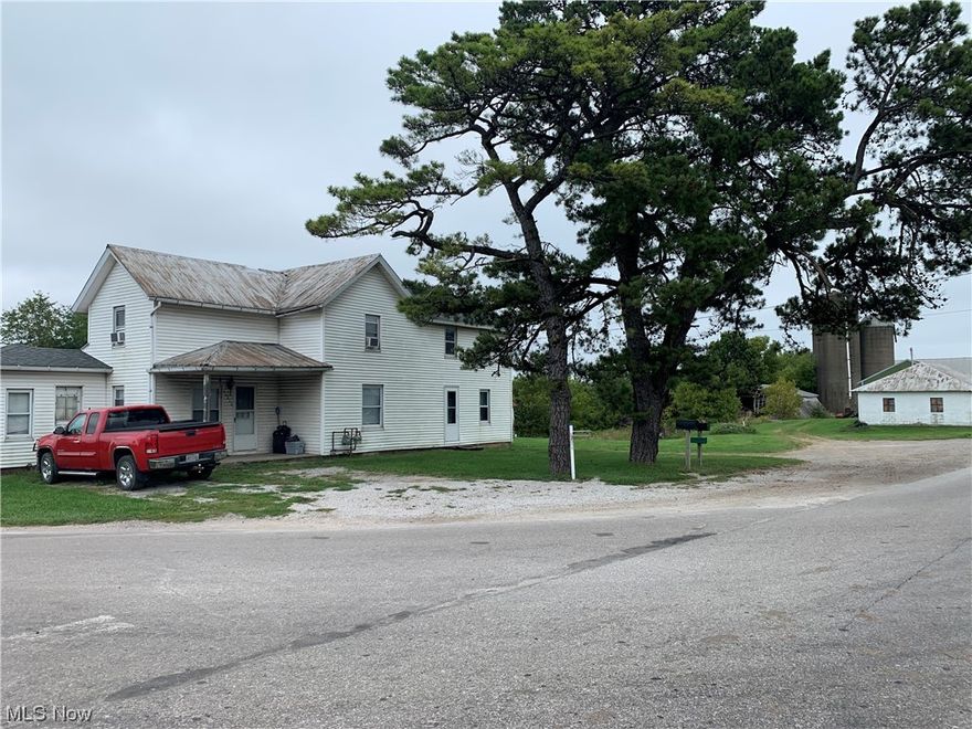 In a good location, between Apple Creek and Mt. Eaton, on US 250. Selling an older 2-story home that has been duplexed as well as an older bank barn, a 24’x50’ detached garage, and a 30’x50’ pole building. The one rental unit has on the main floor, a kitchen with dining area, living room, 1 bedroom and 1 full bath. The upstairs has an additional 2- 3 bedrooms. The second unit has on the main floor a kitchen with dining area, living room, 1 bedroom and full bath. The upstairs has 1 additional bedroom. Has natural gas forced air heat, private water well & septic. Units have separate utility meters. Good location and accessibility. All the above on 10.86 acres with excellent commercial site potential.