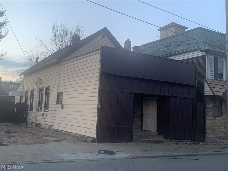 Welcome to this unique opportunity to own 4 br single plus retail front unit with approximately 400 sq ft. + Garage and fenced in lot. Last occupant was  here for over 10 years. Total square footage is over 2500 sq ft. Updates in 2019 includes : new deck, newly painted exterior and interior, new kitchen cabinets, mostly new windows, electrical panel, electrical outside incoming mask, new carpeting, and new fixtures. Come and be part of upcoming Slavic Village development, get in before prices and rates rise ! Seller will finance with substantial down payment. New asphalt drive ! Basement just painted and lead clearance in process.