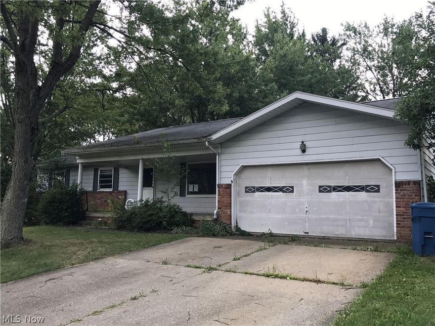 This home features a large corner lot with fenced in back yard, 2 car attached garage and a nice front porch to enjoy those summer
evenings. When you walk in the front door there is a living room to the right featuring a large picture window. Continue on into the home
to the Dining room. The nice size bedrooms and bathrooms are to the left and the Kitchen and family room are to the right. The Family
room features a fireplace for the cold winter evenings. From the family room there is a sliding glass door to access the spacious back
yard. The basement has 2 finished rooms and lots of area for storage or finish the entire lower level for more living space.  Shed also in back yard.  This home needs some TLC.