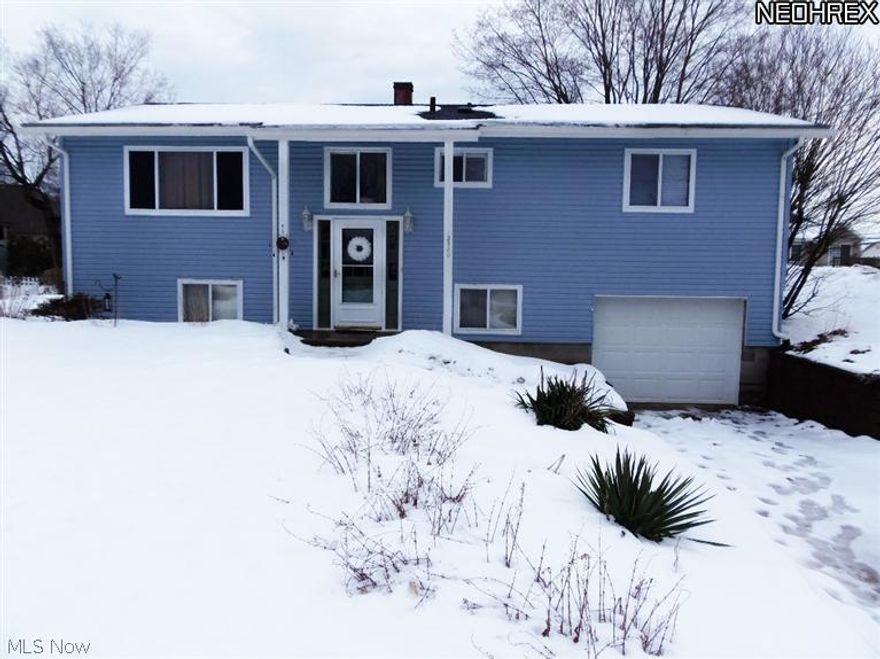 Many updates to this beautiful & spacious bi-level in Norton Acres.  New carpet in living room w/ wood floors underneath. Sliding glass patio door leads to expansive deck that overlooks large fenced yard & patio.  Updated kitchen features pull out oak cabinetry and dinette. Large family room in lower level with large half bath & closet could be 4th bedroom/master suite. Freshly painted through out. His and hers closets in master bedrm. Play-set & shed included.All  appliances included.  Dishwasher new '12. Roof new in 2007, Siding & gutters in 2009.  Central a/c and furnace new in 2003. Newer garage door w/ keyless entry 2011. Electrical panal 2001, Newer concrete driveway with extra parking pad. New footer drains & professional landscaped including Versa-lock stone walls 2006. 12 x 10 Shed & play-set stay. Lots of storage in this home!  Well bladder 2012, Public sewer system. Easy access to expressway!