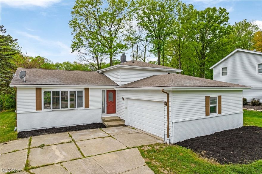 Welcome to this beautiful 4 bedroom 2 bath split level in Twinsburg. This home has been fully remodeled with new LTV flooring all throughout(2023) custom kitchen which features new counter tops, sink, light fixtures, dishwasher, stove, and microwave (2023) All bathrooms have been custom with new showers, vanities, flooring and lighting. The lower level has double sliding doors which lead to the deck and backyard plenty of space for family gatherings and relaxation. This home also has an attached 2 car garage. Schedule your private showing today!