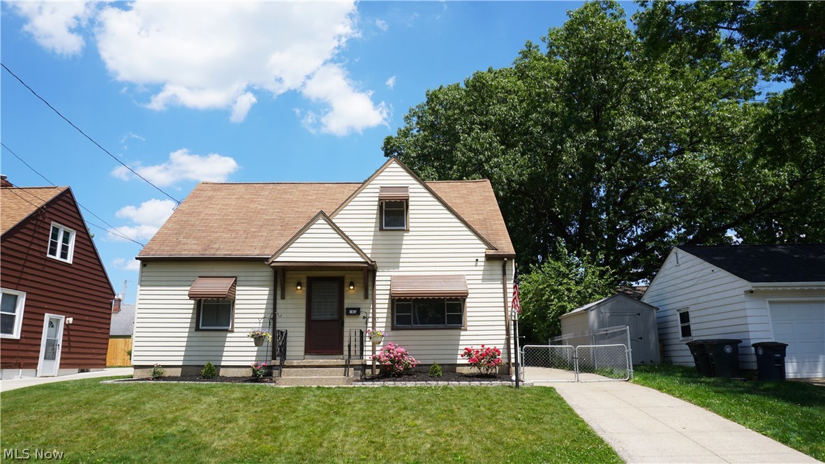 Excited to present this tremendous Cape Cod in a desirable Goodyear Heights neighborhood near the Goodyear Metroparks. The home is situated high above the road with a fully fenced-in backyard which creates a very private setting. Enter the home through the covered front porch into a sizeable living room with hardwood floors and an oversized picture window providing plenty of natural light. Galley style Eat-in Kitchen has a Dinette area with sliding door access to the back patio. The Kitchen is equipped with white cabinets and appliances and a newer stainless-steel farmhouse sink and updated faucet. Down the hall, two main floor bedrooms, both with hardwood floors, share a nicely updated bathroom with ceramic tile flooring. Upstairs, a highly flexible space currently serves as the primary bedroom. Carpeted with plenty of storage and a unique niche, it is the perfect addition to the main floor bedrooms. Downstairs, the finished basement serves as both a media/family room and an exercise room. Sporting warm tone LVP flooring, glass-block windows and neutral paint, the spacious finished area will meet all your needs. A separate utility room contains laundry hookups, as well as additional storage space. Outside, a detached, single car garage with door opener sits at the end of a concrete driveway. An extended concrete patio is graced with a portable gazebo while a narrow wooden deck provides a secondary sitting area in the backyard. A wooden and chain-link fence encompasses the entire backyard and helps delineate a private space. Updates include: Furnace (’23), Central A/C (’23), Electric Panel (’18), Kitchen Appliances (’18), Hot Water Tank (’09). Contact your favorite Real Estate Agent today and schedule your private showing before this one is off the market.