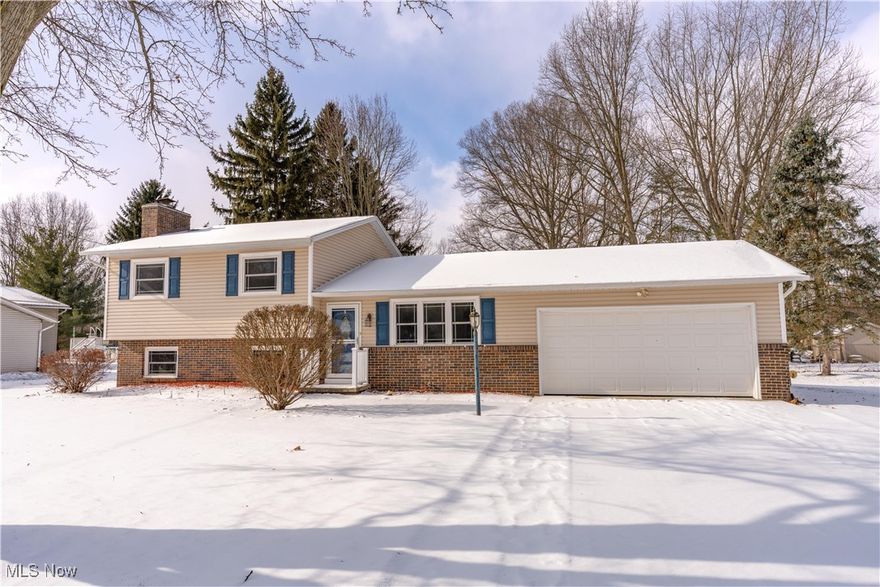 Beautifully updated 3-level split in the heart of Jackson Township on a ½-acre lot with peaceful views! Brand new carpet and freshly painted throughout. Nearly all major improvements have been completed within the past 10 years, including roof, high-end ProVia siding and Provia double-hung windows, handcrafted fiberglass front door with obscure glass, Carrier furnace and A/C, and 200 AMP electric service. Additional insulation and house wrap were added throughout the home and garage, including under the siding and in the attic (R-26+). The eat-in kitchen features stunning Amish-built birch/cherry cabinetry with crown molding, built-ins, rollouts, and a lazy Susan, plus quality appliances including a newer dishwasher (2022) and refrigerator (2023). A rarity in a split-level, this home includes main floor, direct access from the garage to the kitchen! The living room offers a warm, welcoming feel with its crown molding, triple window and colonial-style muntin grilles between the glass! Upstairs includes an updated full bath, three comfortable bedrooms with brand new carpet and paint. The primary bedroom has its own private half bath. The lower level adds even more usable space—cozy family room with new carpet, a gas fireplace, custom Amish-built cabinetry storage with roll-outs and a tall space, and an additional flex room ideal for a 4th bedroom, office, workout room, or hobby space also with new carpet. The utility/laundry room includes convenient walkout access to the backyard. Enjoy outdoor living on the large screened-in covered porch and attached Trex deck with vinyl railing. A Weber Genesis natural gas grill is included—no propane refills needed, EVER! A fully vinyl-sided 12x8 shed and oversized 2.5-car garage provide excellent storage. All of this in a prime location close to Jackson schools, North Park & Amphitheater, The Strip shopping area, CAK Airport, I-77, and Route 21. A wonderful opportunity to settle into one of Jackson’s most convenient areas!