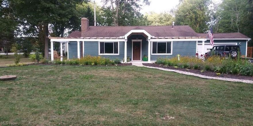 Charming 2 bedroom home with 2 car attached garage. Features tons of newer updates including; Furnace, water softener, Electrical system, water heater, A/C, lighting and flooring.  The Porches, portico's and concrete were also recent additions. Fireplace and built in shelves in the living room, Corner built in china cabinet in dining area, large pantry off kitchen, two walk in closets in master bedroom. Two lots for a total of .82 Acres.  Easy access to St Rt 8, I-271, and the turnpike. Hudson Schools. 2nd lot backs up to the Hike and Bike Trail.