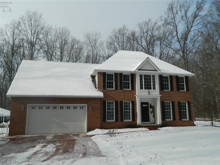 This beautiful two story home is situated in a very private, country, scenic setting on 5.8 acres of land with deer on the property. This brick and vinyl sided house sits back off of the road with a two car attached garage. There is an abundance of windows letting natural light in. Over 1800 square feet are made up of four bedrooms. A beautiful fireplace and wood flooring make up the main floor living room. The oversized kitchen with plenty of counter and cabinet space opens up to a dining space with beautiful views of the wooded property. Owners have Spectrum internet. Downstairs is a finished basement with a large family room and kitchen area. Heading outside, there is a large 24 x 32 building with electric that has an overhang perfect for entertaining as well as a large patio. (Curtains and curtains rods are not included.)
