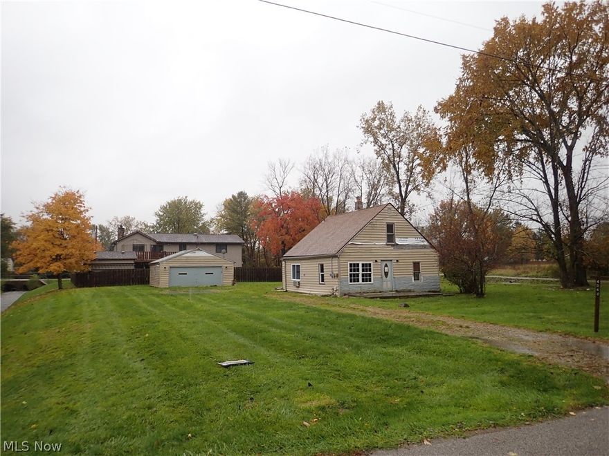 Convenient, fantastic location! Extra large corner lot located at the end of a dead end street! 3 bedroom, 1 bath home. Gorgeous, wooded 1/2 acre lot! 2 car detached garage! Rehab or tear down and built new here!!