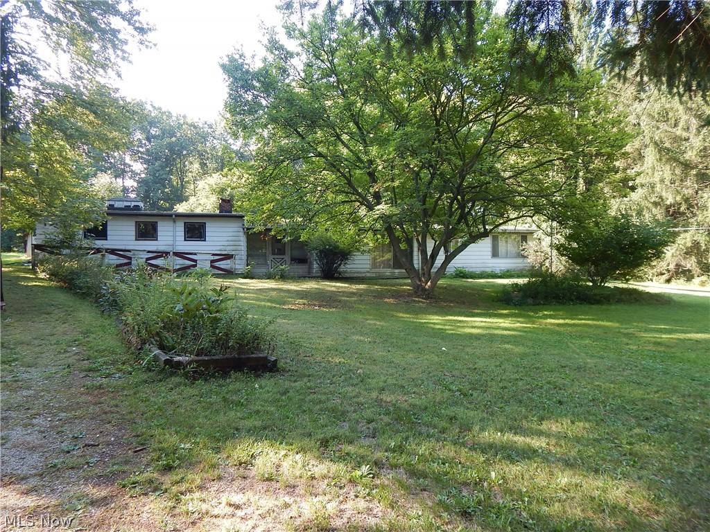 Give me space with Endless Possibilities! Home is original state condition. Need Updates but offer many possibilities or tear down and build new on this Wonderful 1.75 Acre Lot Features Living Room, Family Room and oversize laundry room. Three Car garage attached. Storage Shed. The true value is in the land.