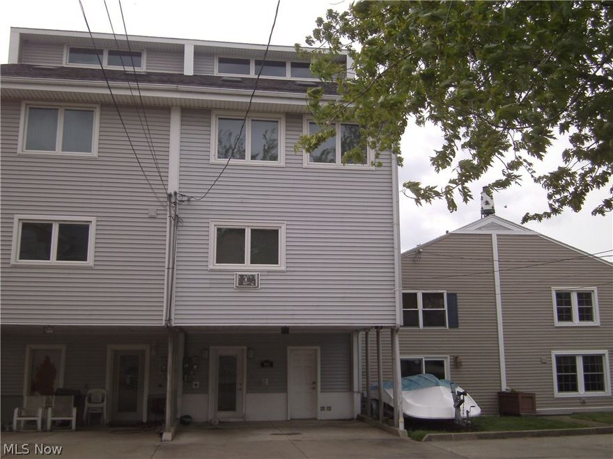 Boating on Lake Erie just got better! Enjoy this immaculate multi level boat house that is perfect for year round living or enjoying long weeks and weekends in the summer. Located on prestigious Bimini Drive it features a boat well that is approximately 36' X 13' so you can be sure your boat is safe and secure. Plenty of storage space throughout. The first level has closets that lead to the boat well and a separate entrance for storage. The second level features a large laundry room. Washer and dryer included. Moving up a level the master bedroom has his and her closets plus a master bathroom. The next level features the eat in kitchen with all appliances. Topping off the boathouse is two more levels of living area that can sleep up to 6 more people. It has a cathedral ceiling and skylights to enjoy all the natural lighting that is throughout the dwelling. The upper outside deck has beautiful views of Sandusky Bay and Cedar Point. Don't foget the dumb waiter for convenience.