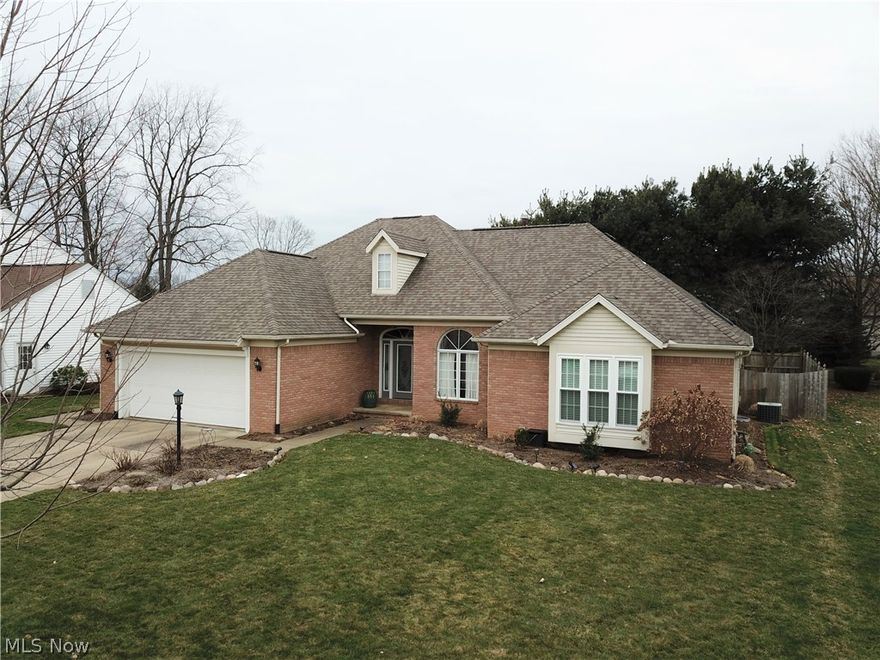 Welcome to 5715 Kings Gate Circle NE in North Canton! You will fall in love with this incredibly beautiful 3-bedroom, 2 bathroom ranch the moment you walk inside and see the gorgeous wood flooring in the foyer, living room, dining area, and hallway. The cozy living room has a fireplace and recessed lighting. The kitchen has stainless steel appliances, a beautiful backsplash, recessed lighting, tile flooring, and gorgeous oak cabinets. A spacious bonus room with large windows overlooking the fully fenced-in backyard is located off the kitchen and living room area. The large master’s suite has a convenient walk-in closet and a state-of-the-art master bathroom. The master bathroom has a soaking tub located right underneath a half-moon window, a large vanity, and a shower with subway tile. This home has two additional bedrooms and a full bathroom. The backyard has a privacy fence, a wooden deck, and a concrete patio. This home has an attached two-car garage. Located on a cul-de-sac. Pain T