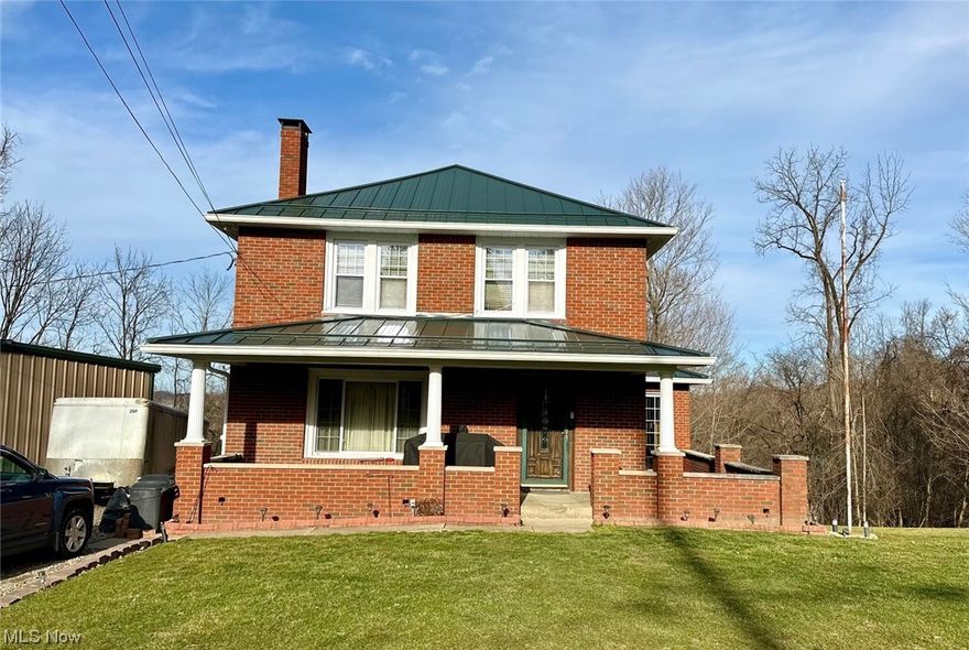 Welcome to 73105 Holzworth Road! This home has it all! Total brick, 3 bedrooms, 2 full bathrooms and a cozy wood burning fireplace in the living room. If you love the charm of woodwork, you will appreciate the original wood trim, floors and built-ins that grace this home. Too many updates to mention, but here are a few- replacement windows, standing seam metal roof, soffit/facia/gutters, sliding glass door in the kitchen, central air and two fully remodeled bathrooms. The free-standing gas fireplace in the basement recreation area also stays. All this perched on a 1-acre country lot to include a mechanics or handyman's dream garage. Measuring at 30 x 50 and built in 2015, this garage is total steel construction with 5-inch concrete floors and has water, 100-amp electrical service and three 10 x 10 garage doors with a center garage height of 13' 3".  In addition, Pex tubing for radiant floor heat is in place but needs to be connected by the next owner. Per the auditor's site, this home