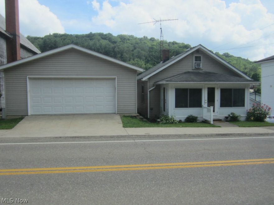 Adorable ranch home on alley bound lot. Hardwood floors in kitchen & dining room. Carpet in living room and hallway new in 2011. Bath remodeled in last 3 years.  Enclosed sun rooms in front and back of house. 23x23 garage with a 23x23 lower level area built in 2002. Garage includes electric. Fenced in yard. Any mineral rights seller owns will pass to buyer. Subject to seller finding suitable housing of their choice.