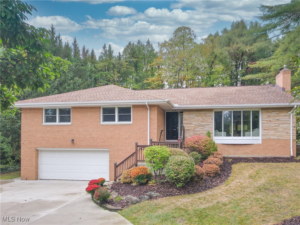 ** Offer Deadline of Sunday (9/28) at 5pm. Tucked along a quiet tree lined lane in the heart of Brecksville, this all brick ranch offers a rare combination of timeless construction, thoughtful updates, and serene outdoor living just minutes from the Metroparks and the charm of downtown. Step inside to find a bright and welcoming layout where natural light fills every corner. The completely renovated kitchen is the centerpiece of the home, featuring custom cabinetry, Bosch appliances, and an oversized quartz island that invites gathering and conversation. Hardwood floors with classic narrow planks extend throughout the main level, flowing into an elegant dining area and a comfortable living room centered around a new gas fireplace. Four generously sized bedrooms provide plenty of space for family and guests, including a tranquil primary suite with a California Closet system and a freshly updated bathroom. The lower level extends the living space with a walkout design that includes a large flexible area suited for a media room, guest suite, or kid’s play area. A full bathroom and walkout access to the backyard make this level as functional as it is cozy. The sunroom may be the most cherished part of the home, where the large windows offer sweeping views of the wooded backyard and provide a year round retreat. Step outside to discover a multi tiered deck, lush landscaping, and visits from local wildlife. This property is as practical as it is beautiful, with important updates already complete. Pella windows, a new HVAC system, water heater, resurfaced garage floor, and a new gas fireplace add comfort and efficiency. The long driveway, oversized garage with hot and cold water, and countless custom details make everyday living both convenient and enjoyable. Less than a mile from Brecksville’s town center, top rated schools, and major commuter routes, this home blends quiet seclusion with unmatched accessibility.