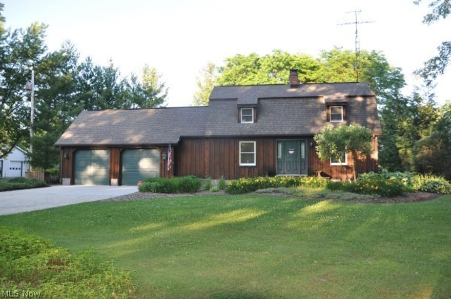 Beautiful 3 bedroom, 2 bath Cape Cod on 7.5 acres features a lovely stone fireplace in living room, cozy family room leading to covered deck, remodeled kitchen w/new appliances, open floor plan, 2 car attached garage w/2nd story, detached 24 x 32 garage w/heat, electric & water. Extensive landscaping!