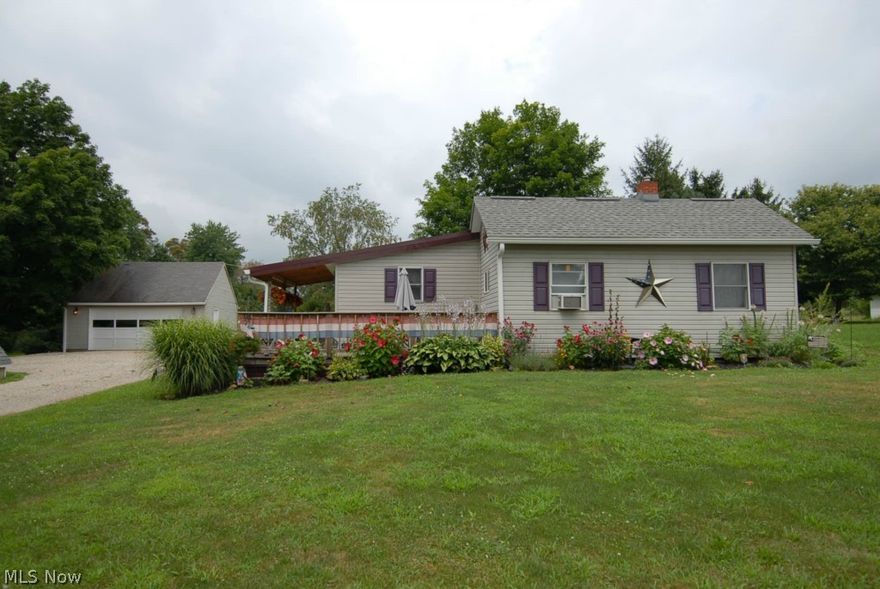 Country setting with room for a garden. Detached 2 car garage w/storage above. Tri Valley schools. Nice cozy small cottage. Deck on side.