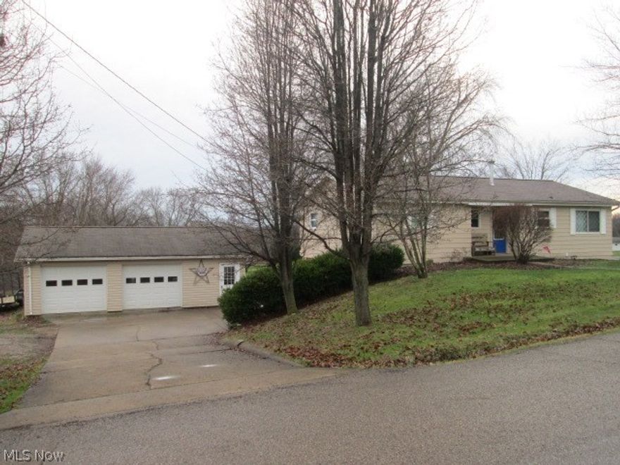 Must See!!! Beautiful newly updated 4 bed and 1 1/2 bath 1 story with a 4 car detached garage and man door. Has hardwood flooring throughout and a tiled bathroom. The French doors in the kitchen open onto a big deck that overlooks the back yard and has a concrete patio below. The kitchen is newly updated and includes a stove and refrigerator. Has a shed in the rear and  a new roof. This property has 2 lots, extra lot is 132 x 288.