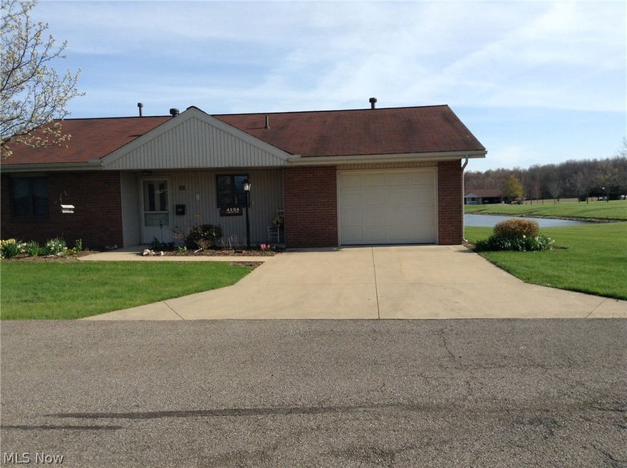 You will never have to worry about your feet getting cold, this condominium offers you heated floors throughout.  What a beautiful view you have from your windows, patio or sunroom of the pond right behind you.  If you love to fish this is perfect spot for you.  You will love the open floor plans from the kitchen to the dining/and extra large living area. There is plenty of storage from the extra space in the garage to the many closets and cupboards.  The master suite offers you a private bath along with 2 large closets and a full washer and dryer close by. The second bedroom you can use as an office or sewing room. No worries about maintenance, your HOA fee covers association insurance, trash, water, sewer, snow removal, lawn care, roof and siding repair.  The appliances will remain including a full washer and dryer.  Call now for a showing!