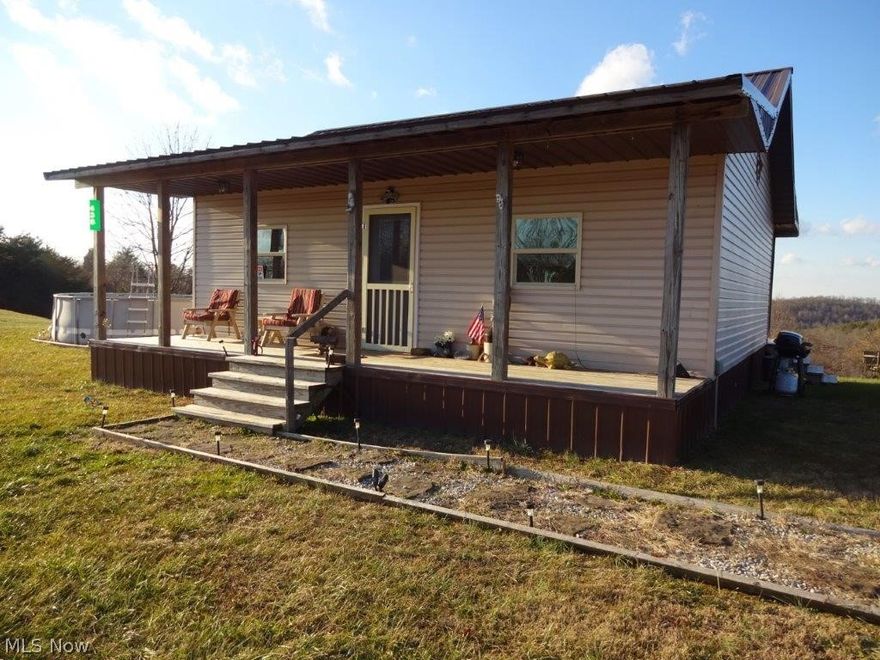 Nice well maintained 2 Bed, 1 Bath cabin on 14 Acres features, eat-in kitchen, large living room sleeping loft, full bath w/ walk in shower, front + back porch, utilities, electric & propane, holding tank for water, partially level yard, mostly wooded with undeveloped spring, lots of wildlife, close to public hunting.