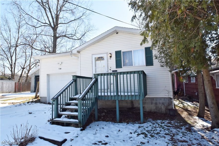 Welcome to this cozy, move-in ready home where you can enjoy the convenience of one-floor living. The freshly painted living room is highlighted by a large picture window, ceiling fan & coat closet. The eat-in kitchen has oak cabinetry and spacious counter tops; the refrigerator and range convey with the property. The light-colored bedroom includes a sizable closet and is next to a full-sized bath. The living room and bedroom have carpet, and there is attractive luxury vinyl tile in the kitchen, bath and laundry. The hallway adjacent to the living room offers great potential to be used as a mudroom or flex space. The single-car garage offers ample storage space, and the unfinished basement provides additional storage. Enjoy warmer NE Ohio evenings on your front porch. The home is accessible to I-77/I-76, Rt 8, and downtown Akron. The seller is providing a 1-year home warranty for added peace of mind. Call to schedule your showing today!