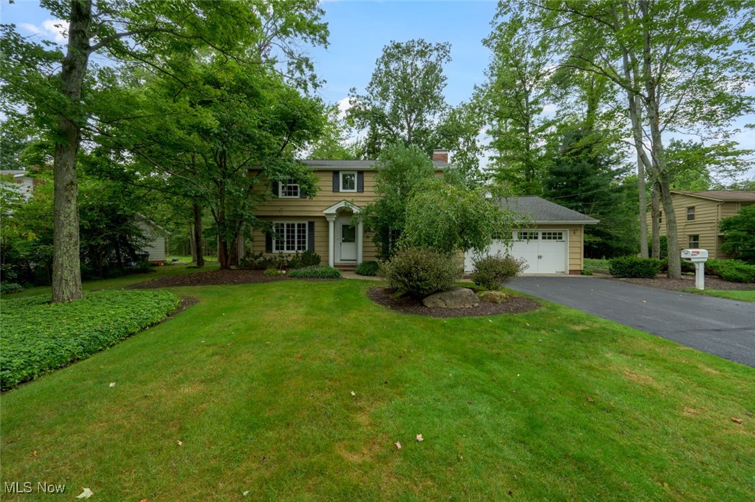 Desirable North Solon colonial on almost 3/4 acre featuring 4 bedrooms, 2.1 baths. Nicely landscaped with private back yard and 13X18 raised composite deck. This home has good bones, just needs someone with an eye for decorating to update it. Large family room with gas fireplace and lots of storage. Eat in kitchen, grand dining room and extra large living room and half bath completes the first floor. Upstairs there are 4 large sized bedrooms with hardwood flooring, primary has 2 large closets and en suite bath with shower. All 3 remaining bedrooms have walk in closets!! Upstairs main bath has tub/shower combo. Lower level is 33X24, laundry, glass block windows, newer hot water tank and furnace 2022. Newer gutters. Additional 2 car parking pad. Bring your vision to this charming colonial and make it your own!