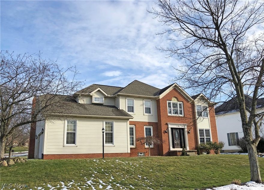 Welcome to this stunning property in the St. Ives neighborhood of North Canton - this home has so much to offer! An updated kitchen with granite counters, stainless steel appliances, fantastic center island with breakfast bar, planning desk, and large pantry. French doors off dinette area lead to a maintenance-free deck and patio area. Large family room with gas fireplace, spacious dining room and living room, an office with built-in library shelving, and a first floor laundry. Second floor features a huge master suite with dressing room/sitting room, ensuite bath with soaking tub, separate shower, and a walk-in closet, plus 3 more spacious bedrooms and large main bath. Finished lower level is great for entertaining, with a rec room, possible media room, a play area or possible 5th bedroom, plus an ample amount of storage space. 50 year roof installed and windows replaced approximately 2014. All this plus so much more - call for your private showing today!