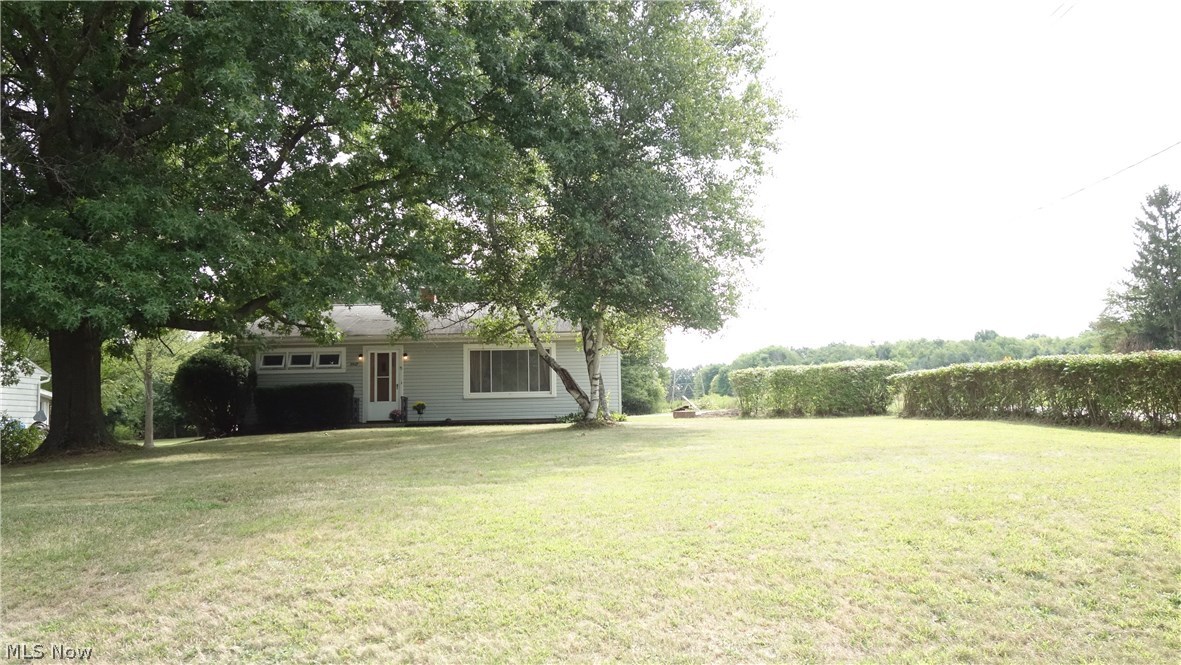 *NO STEPS INSIDE* and only gentle steps into this warm, inviting ranch with the convenience of having every room on the first floor..nestled on over a half acre of beautiful land w/ room to park your RV and/or boat!! The living room is extra large, a sunshiny eat-in kitchen w/ room for your table & chairs right next to a window**An over-sized 1st floor laundry/utility/mud room as well. A "jumbo" 1.5 car garage that has room for storage and more than just one vehicle. Bonus: the well & septic were tested w/a Summit County Transfer Certificate obtained, dated August 2018 attached herein...septic was pumped as well. This "gingerbread" ranch is lovely from the inside-out, located on a lovely street of established homes and priced to sell quickly w/ many updates. Simply minutes to the Portage Lakes State Park w/ public boat launches (see photos)! Move-in ready upon closing!!