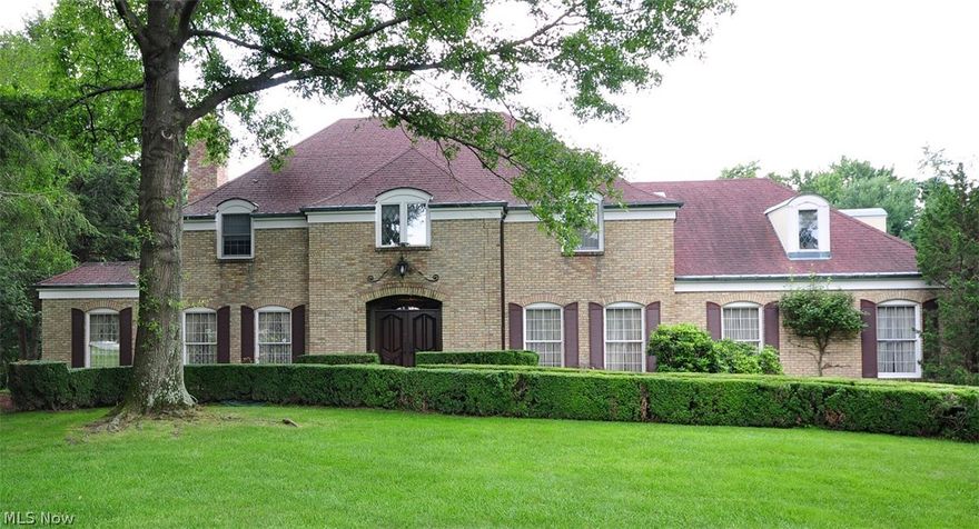 Custom quality brick French Provincial Estate in Northwood near County Club.  The home offers spacious private setting at end of cul de sac.  Two story, 5 bedrooms, 3 full and 2 half baths.  Wood floors in living room, dining room and upstairs hallway, living room with antique marble and stone fireplace.  First floor family room has hand made brick wall fireplace and lovely raised panel walls.  The marble floored foyer has open staircase and leads to formal dining room.  Magnificent wall of custom furniture cabinets built in plus parquet wood floors and crystal chandeliers.  Fully applianced eat in kitchen, first floor laundry, solarium with vaulted ceiling, 4 skylights, quarry tile floor, bar, sink and wine cooler, 3 car garage.  3 zoned F/A Gas heat and central air.  Underground storage building.