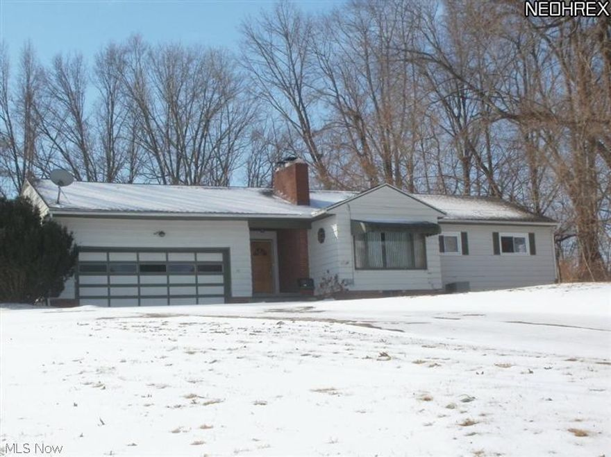 Country ranch with 4 bedrooms and 2 baths situated on almost 1 acre.  Many updates!  Porch & patio, living room with fireplace, skylights in kitchen, large family room.