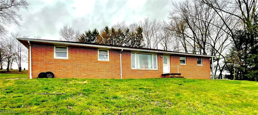 This house on a hill has the most amazing view! 9810 Ziegler Road could be your dream come true. This brick ranch sits on over an acre. With 3 bedrooms, eat-in kitchen, living room, 4 season room, and last but not least, an oversized attached garage, it is all you need to be HOME. Priced just right for the work it needs, it will not last long! Don't wait!