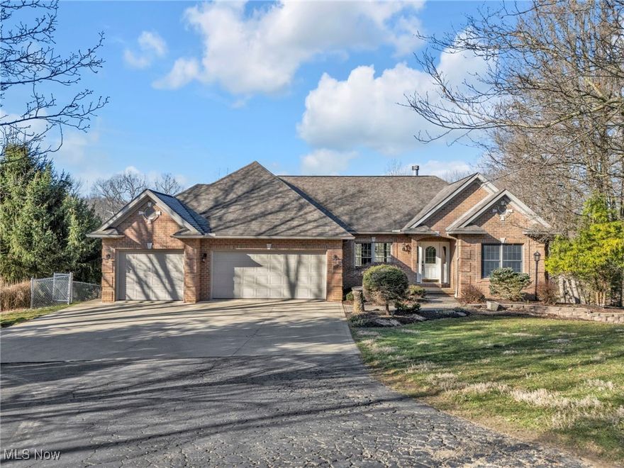 This stunning 5-bedroom, 3-bath brick ranch sits on over 2 acres of breathtaking hillside, combining comfort, style, and functionality. Designed for multi-generational living or effortless entertaining, it features two kitchens, two laundry rooms, and fresh carpeting and paint throughout. Recent updates include a remodeled main bathroom, refreshed guest bathrooms, and upgraded lighting for a modern touch. The fully finished walk-out basement adds valuable living space, while two fireplaces create a warm and inviting atmosphere. Outside, the fenced backyard provides a secure area to enjoy, and the three-car garage with an extra parking pad offers plenty of room for vehicles and guests. A whole-house generator ensures peace of mind year-round. Don't miss this rare opportunity—schedule your private showing today!