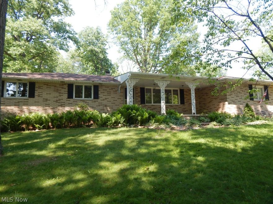 Sprawling Brick Face Ranch style home. Spacious living area, eat in kitchen with freshly painted walls. 
Enjoy the day in the family room with wood burning fireplace. Nice size bedrooms, full size lower level 
basement. Carpet in half of basement the other half storage and laundry. Two car att. Garage. 
Other room is screen porch. Beautiful lot with flat back yard. Patio and much more.
Newer roof 2010 and city sewer connection  2010.