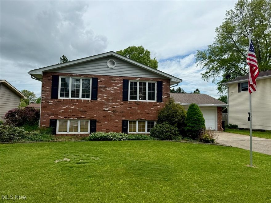 There's plenty of room in this five bedroom, two and a half bath home with two kitchens! The upper level has three bedrooms, one and a half baths, large living room, kitchen with plenty of storage and dining room.  Downstairs you'll find two additional bedrooms, a full bathroom, kitchen & dining area, living room and laundry. A great space that could be set up as a potential Mother-in-law suite or apartment for extra income! A second laundry hookup is located in the oversized two stall garage which walks out onto a concrete patio area and large level lot. Recent updates include A/C (2021), hot water tank (2022), roof (2016), furnace (2008), garage door opener and torsion springs (2022), some flooring and light fixtures.