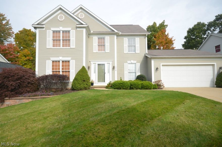 Tallmadge Hills- rare wooded view out back! Tons of updates plus a theater room! Hardwood foyer flanked by office/living rm & formal dining room w crown molding. Open layout great rm –fireplace w mantle. Big eat in kitchen w new glass mosaic backsplash, ample raised panel cabinets & pantry closet plus  ½ bath w updated fixtures & 1st floor laundry w util sink & cabinets. Big 2 tier deck & fabulous back yard w private landscape, storage shed & waterfall feature. Finished basement featuring theater rm w crown molding, surround sound, lights on dimmers & play/rec rm immediately off of the theater room. Big unfinished section w built in shelving & good storage space. Upstairs cathedral master suite w full bth, makeup vanity, step in shower, garden tub w glass mosaic surround & walk in closet. Addtl full bth w tile floor, shower/tub & linen storage. Updates include: ’10 Trane AC, Trane High Efficiency furnace, HW tank. ’12 LG Stainless French Door Refrigerator. ’11 Dishwasher, Marble Firepl