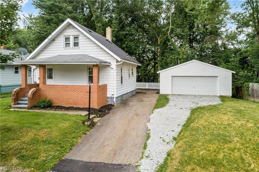 Come see this updated 2 bedroom Bungalow on a quite street.  Nothing to do but move in, freshly painted in neutral colors, all new interior doors and new flooring throughout.  You can enjoy reading a book on your front porch or have a cookout on the large back deck. There is a large family room in the basement, which can be used as a workout room or an office.  Basement has glass block windows, Furnace and Hot Water Tank 2019.   Park your vehicle in the large 2 car detached garage (24 x 24) with remote opener. Sale comes with Home Warranty.  Schedule your showing today.