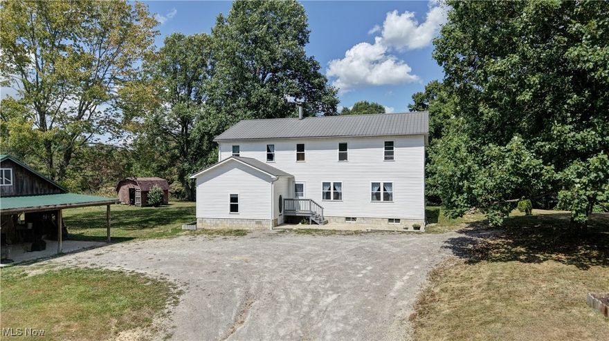 Enjoy the peace and serenity of country living in this spacious and well-maintained home. Set on a 1.1 acre lot, shaded by mature trees this home offers the perfect blend of comfort, space and rural charm. Inside this Amish home you'll find a welcoming layout featuring a large kitchen and living room -ideal for gatherings and everyday living. With 1,700 square feet on the main floor and an additional 1,500 square feet upstairs, this home has 6 bedrooms and 2 bathrooms offering ample space for family or hosting guests. Step outside to large covered back porch, perfect for relaxing and enjoying the peaceful surroundings. A full basement with convenient exterior access. provides plenty of room for storage, hobbies or future expansion. The property also includes a newer-built barn and a storage shed, adding even more functionality and potential to this property. Since this is an Amish home there is no electricity. If your looking for quiet country living with room to grow this might be the perfect property to call home.