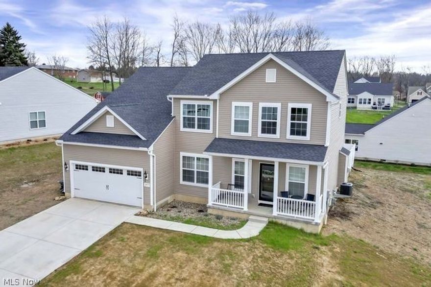 Looking for the luxury of a newly built home without the headache of the building process? Say hello to this beautiful 4 bedroom Colonial, just built in 2023 with premium upgrades to the kitchen, bathrooms, and flooring. Beautiful exterior with covered front porch. Open concept kitchen-living room layout with 8ft.x4ft. Granite countertop island and gas fireplace. Huge walk-in kitchen pantry and a beautiful dining room surrounded with windows for ample natural light. First floor office. MASSIVE 20ft.X15ft. main bedroom with private bath; includes tile shower with glass door, duel sinks and walk in closet. Upstairs laundry room. Extended garage for additional storage. Full open basement with tons of room, endless possibilities, and plumbing hookups ran to easily add an additional bath. Nice size lot with concrete patio in the back, portion of the backyard has vinyl privacy fencing, perfect for those with kids or pets! Plenty of storage throughout the home. Great neighborhood in the Tuslaw school district. New topsoil and grass seed being planted