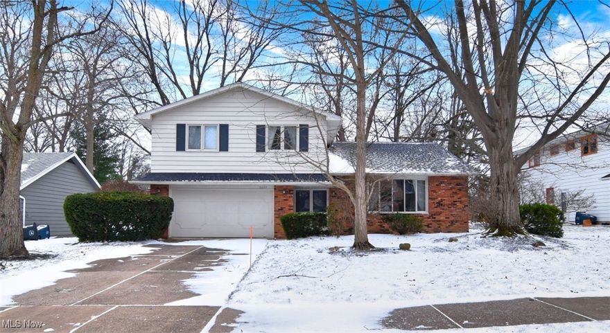 Welcome to this fantastic split-level home located on a highly sought-after street in Lyndhurst! From the moment you enter, pride of ownership is evident. The large, sun-filled living room that flows seamlessly into the oversized dining room—both accented by rich hardwood floors and ideal for entertaining.The beautiful, spacious white eat-in kitchen offers classic subway tile, stunning granite countertops, expansive prep space, and abundant cabinetry. It opens to an inviting family room complete with custom built-ins and a striking fireplace wall. Sliding glass doors lead directly to the picturesque backyard, creating effortless indoor-outdoor living.  The first floor is completed by a convenient guest half bath. All bedrooms are generously sized. The owner’s suite features double closets and a private en-suite bath, while the second full bath upstairs is generously proportioned.
This 4-bedroom, 2.5-bath home offers even more to love: a serene rear yard perfect for entertaining, relaxing on the patio, or gathering with family and friends. The unfinished basement provides endless possibilities—playroom, craft space, workout area, or storage. Additional highlights include a two-car attached garage and a home warranty for peace of mind.Ideally located near Acacia Reservation Metropark with scenic walking trails, Brainard Splash Park, restaurants, shopping, hospitals, and easy freeway access—this home truly has it all.